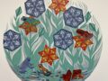 reduction linocut print featuring frogs in a pond with sacred geometry flowers